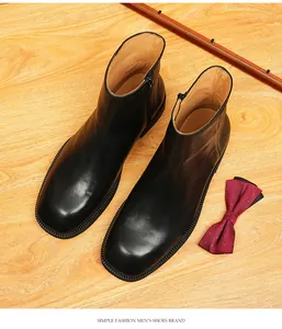 Detailed top view of men's premium black genuine leather Chelsea boots with square toe design