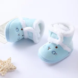 Soft blue plush baby winter boots with white fur trim and cute embroidered face