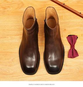 Top-down view of premium brown leather Chelsea boots with square toe detail