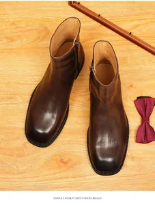Detailed top view of brown square-toe leather Chelsea boots with a side zipper