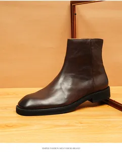 Side profile of men's retro brown leather square-toe Chelsea boots with smooth finish.