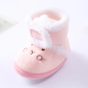 Soft pink baby winter bootie with white fur trim and cute embroidered rabbit face.