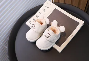 Detail showing thick faux fur lining and cute rabbit ear design of toddler snow boots