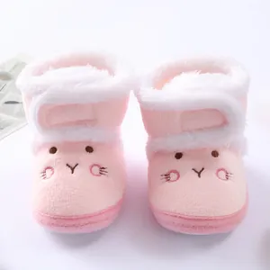 Soft-sole pink baby winter boots featuring cute rabbit embroidery and white faux fur lining