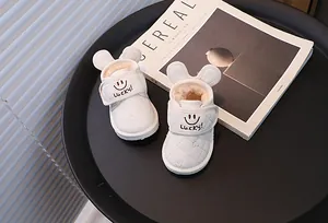Warm white kids plush-lined snow boots featuring smiley face and cute mouse ears