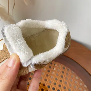 Cozy children's winter sneakers featuring thick white plush lining for ultimate warmth