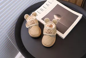 Close-up of children's fleece-lined snow boots with cute ear design and Lucky embroidery