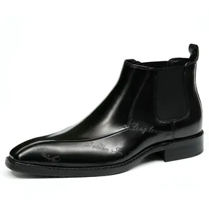 Botas Chelsea clásicas de cuero negro para hombre con punta afilada y relieve elegante