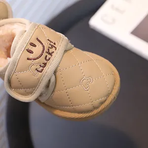 Khaki quilted children's fleece-lined snow boots with Lucky smiley embroidery detail shot
