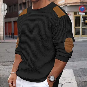 Detail view of men's slim-fit knit sweater with brown shoulder and elbow patches