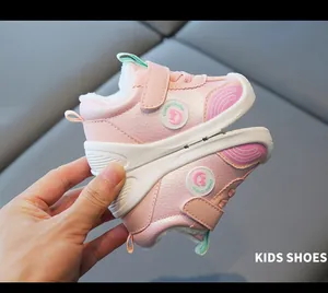 Close-up detail of pink winter baby shoes with warm fleece lining and non-slip soft sole