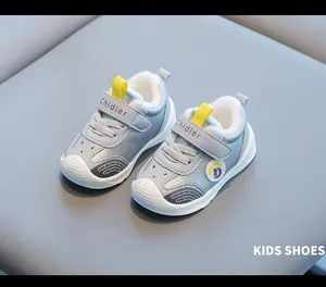 Detailed view of warm fleece-lined kids' walking shoes with waterproof leather finish.