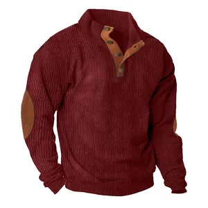 Close-up detail of men's burgundy corduroy sweatshirt with elbow patches