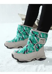 Detailed view of kids' green graffiti snow boots with warm lining and velcro strap