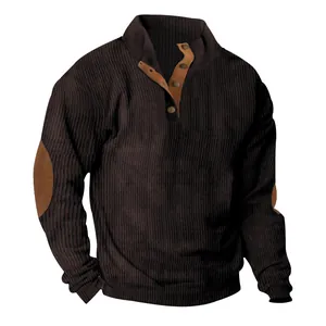 Close-up view of dark brown ribbed corduroy sweatshirt featuring a tan button placket