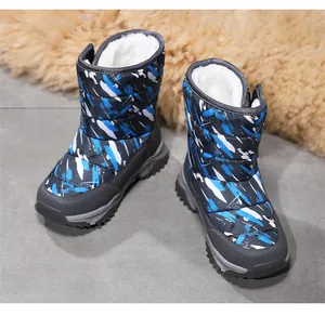 Children's high-top snow boots with blue splash pattern and warm white faux fur lining.