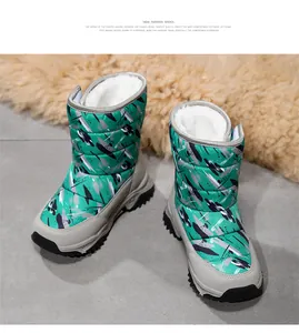 High-top children's snow boots featuring green abstract pattern and plush white faux fur lining