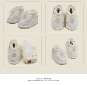 Detailed views of glittery white baby girl snow boots with lace bow and warm plush lining