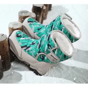 Detailed view of green camouflage children's snow boots with warm faux fur lining