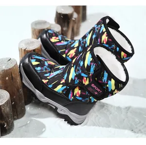 Close-up of colorful patterned children's snow boots with thick white fur lining
