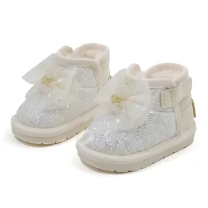 Elegant white glitter baby girl princess snow boots with large lace bow and fur lining