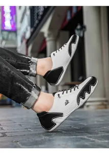 Close-up of casual patchwork sneakers featuring a unique octopus-style sole design.