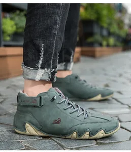 Detailed side view of men's green winter fleece Martin boots with unique octopus rubber sole