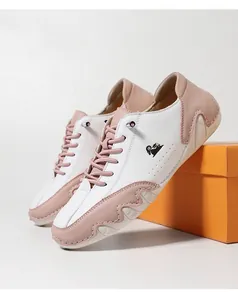 Detailed side view of pink and white low-top casual shoes with unique wavy octopus sole