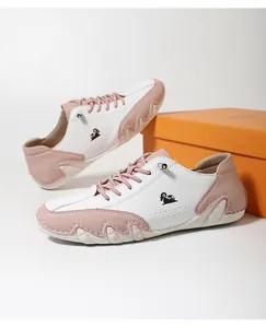 Close-up view of stylish pink and white color-block sneakers with octopus sole