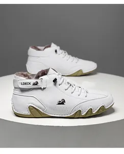 Side profile of white high-top fleece-lined winter boots with octopus rubber sole