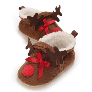 Close-up of cute Christmas reindeer baby shoes with thick fleece lining and corduroy