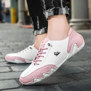 Low-top casual sneakers featuring pink and white colorblock design with wavy octopus rubber sole