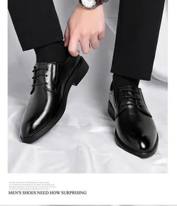 Detailed view of polished black leather men's dress shoes for weddings.