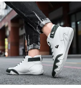 Detailed side view of stylish white and green leather high-top sneakers for men and women