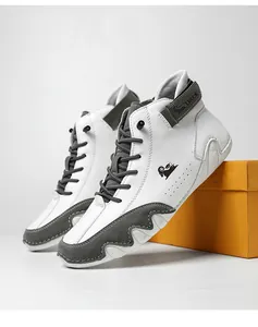 Detail view of stylish white and grey leather high-top casual boots with LDECK logo