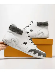 Close-up detail of white and grey leather high-top Martin boots featuring LDECK branding