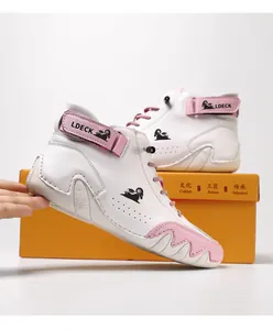 Detailed side view of white and pink high-top leather boots featuring the LDECK logo
