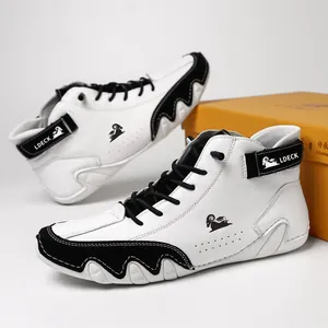 Professional studio shot of black and white color-block high-top leather casual boots