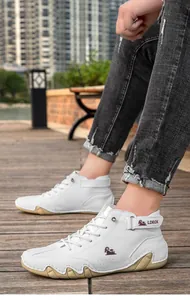 Close-up view of white high-top leather casual boots featuring a unique octopus sole design