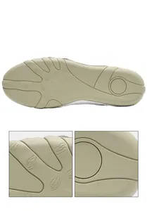 Close-up detail of the anti-slip rubber outsole with unique ribbed pattern.