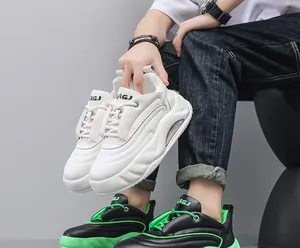 Detailed view of white and black-green chunky air cushion bread sneakers for men