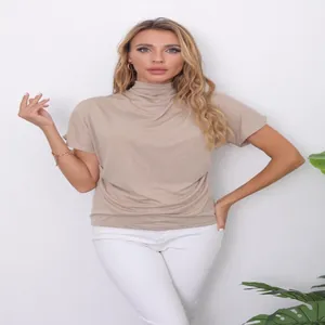 Detail view of a women's khaki mock neck batwing sleeve t-shirt with a relaxed fit.