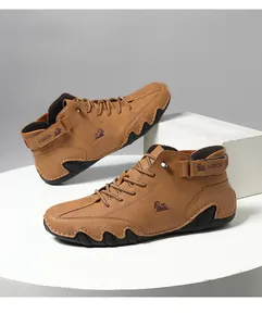 Detail shot of men's brown high-top casual boots featuring octopus sole and LDECK logo