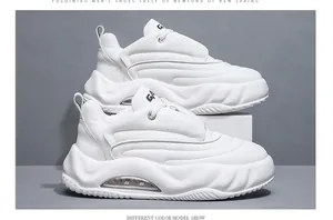 White chunky platform sneakers with air cushion sole and side stitching details