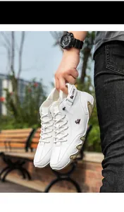 Detail view of white high-top Martens boots with unique octopus sole for men