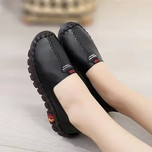 Close-up of black leather casual shoes with soft sole and hand-stitched detailing