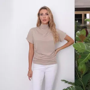 Elegant women's mock neck batwing sleeve top in beige, perfect for casual summer wear