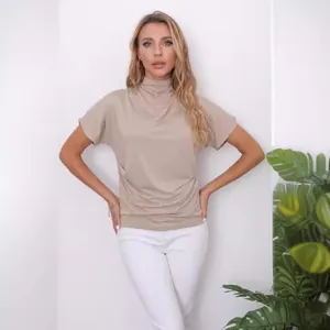 Elegant mock neck batwing sleeve t-shirt in solid beige for a comfortable loose fit