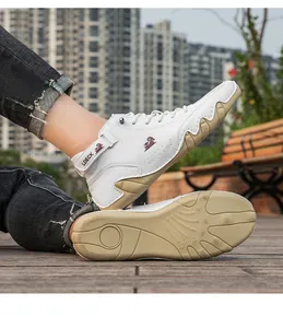 Close-up view of the white high-top casual men's boots showing octopus grip sole