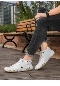 Men's white high-top octopus sole casual boots styled outdoors on model